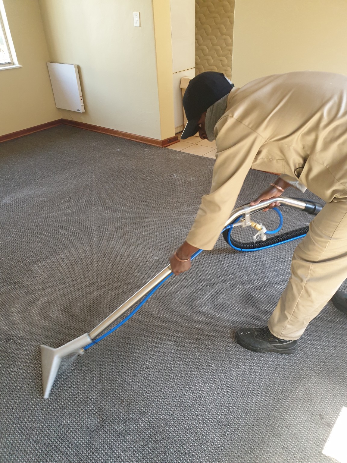 CarpetCleanix technician cleaning a carpet
